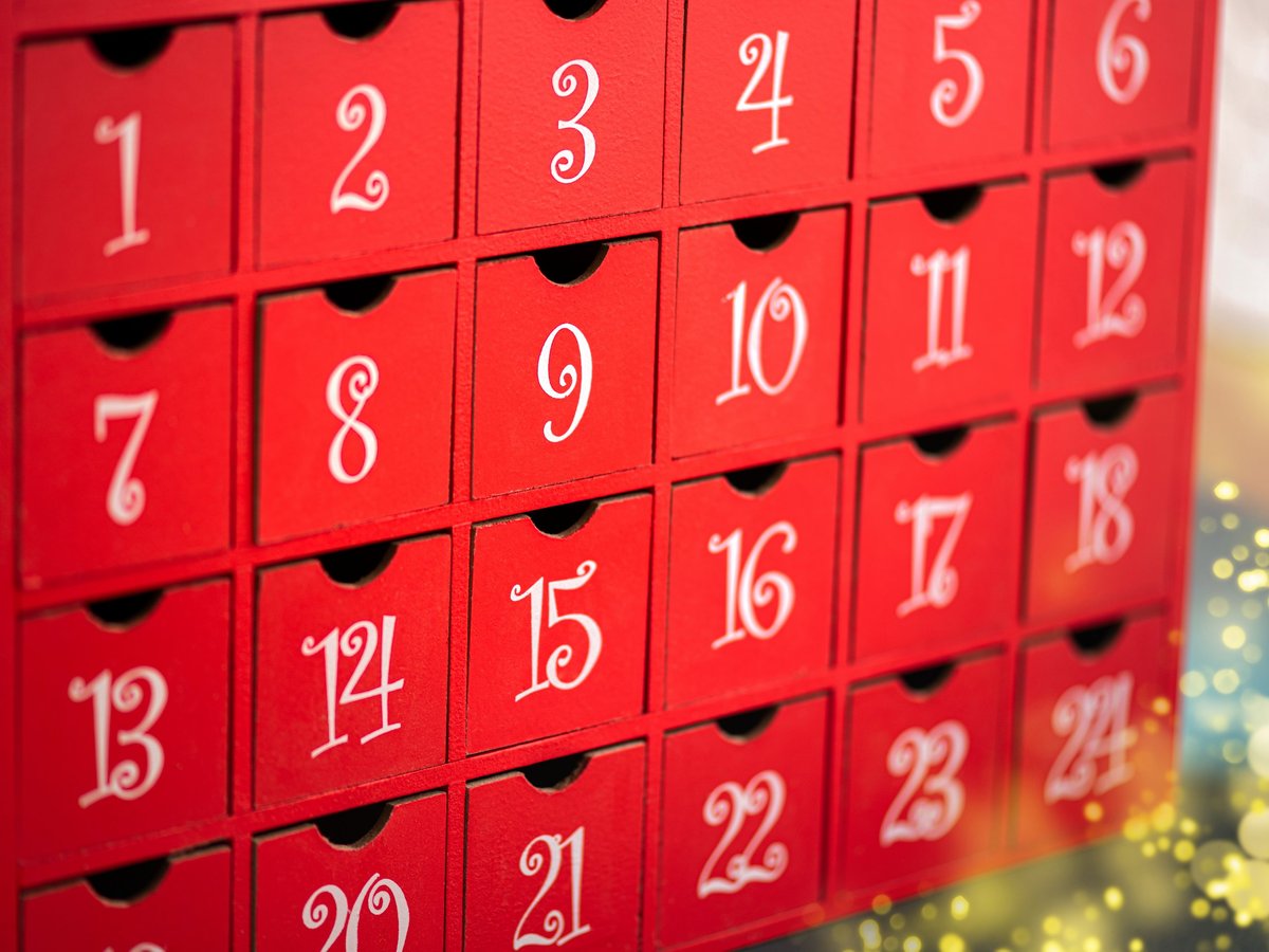 Christmas advent calendar with red packaging and festive decor